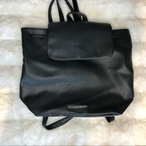Victoria Secrets Faux Leather backpack pull close with magnetic closure.